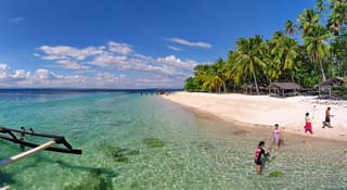 Palm-lined Babu Santa beach on Talikud Island, photographed in 2014